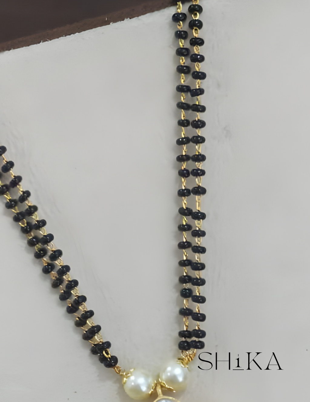 Jadau Kundan Nalla Pusalu Necklace